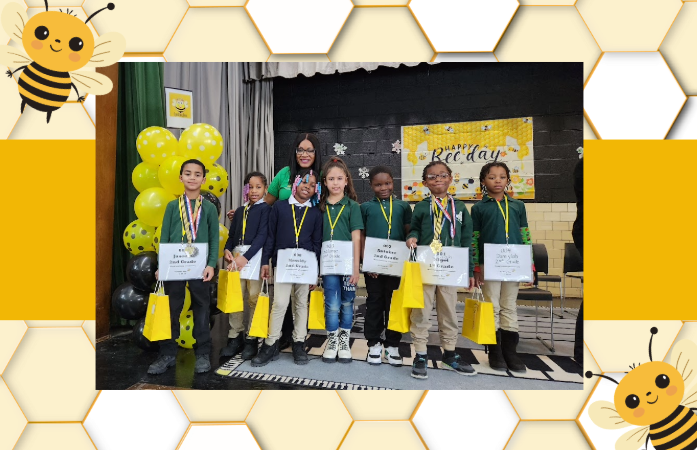  Young students pose on stage with a teacher after participating in school spelling bee